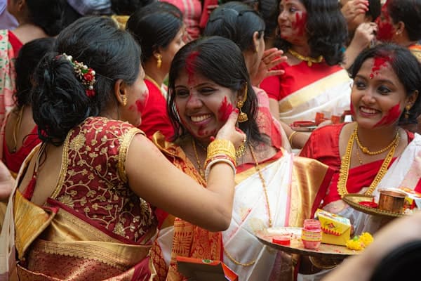A group of women celebrating together, laughing and supporting each other